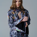 Cosmic Vortex Jacket with monochrome design and vibrant colour accents.