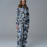 Bold abstract print top with front bow detail and structured fit. A modern, artistic statement piece.