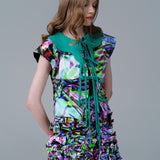 Collar Shirt with psychedelic print and tie up neckline, framed by green accents