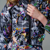 Cosmic Vortex Puffer with monochromatic patterns and bold colour accents.