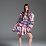 Arlecchino Dress with bold, multi colour patterns.