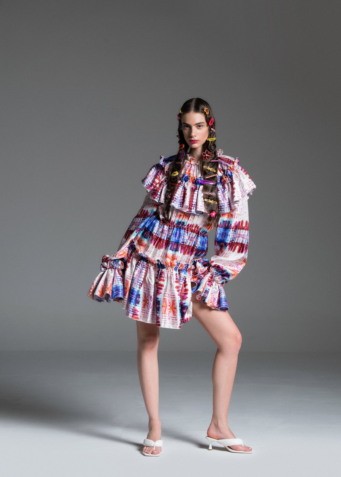 Arlecchino Dress with bold, multi colour patterns.
