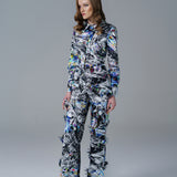 Bold abstract print top with front bow detail and structured fit. A modern, artistic statement piece.