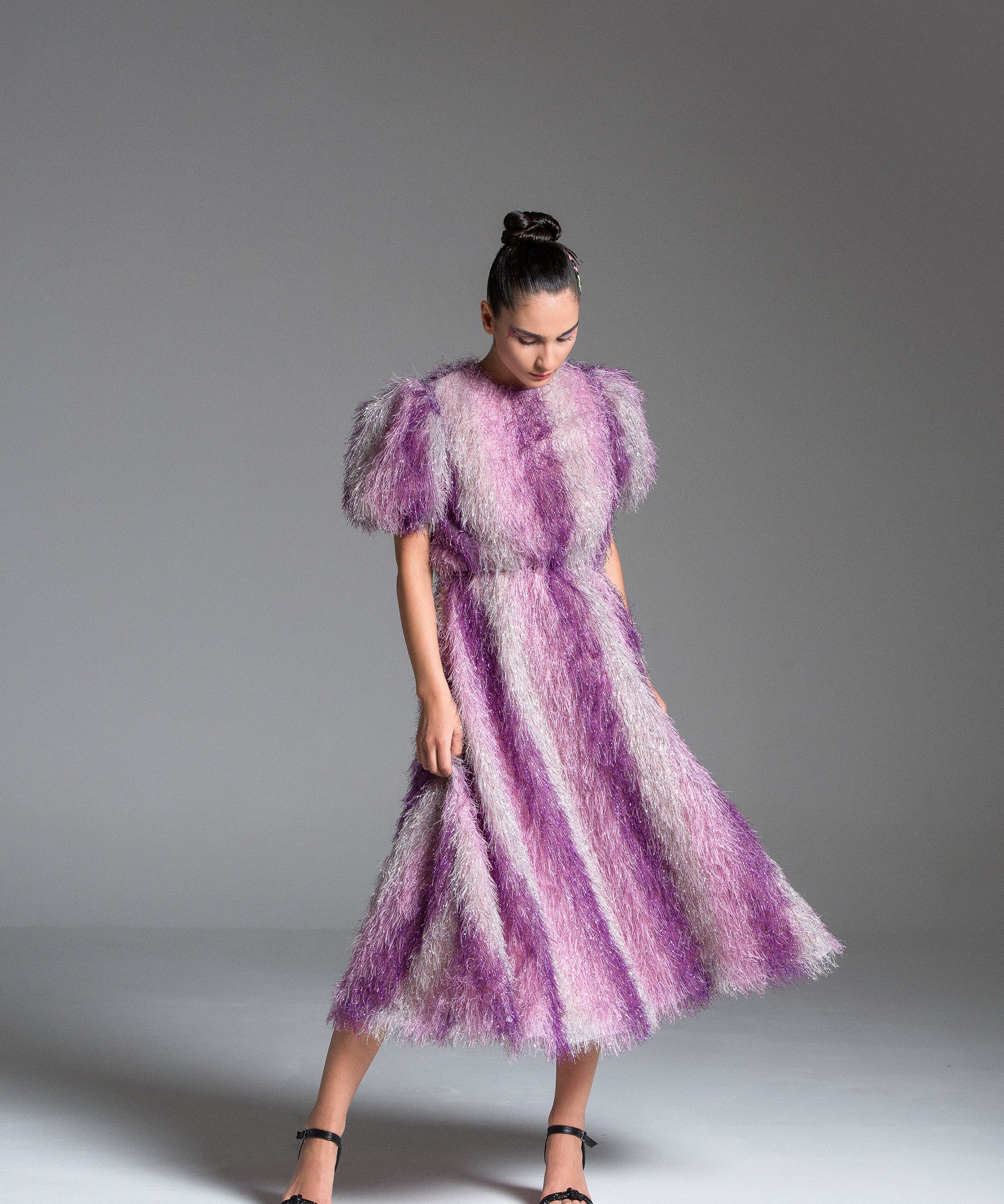 Feather Dress with metallic fabric, short puffed sleeves.