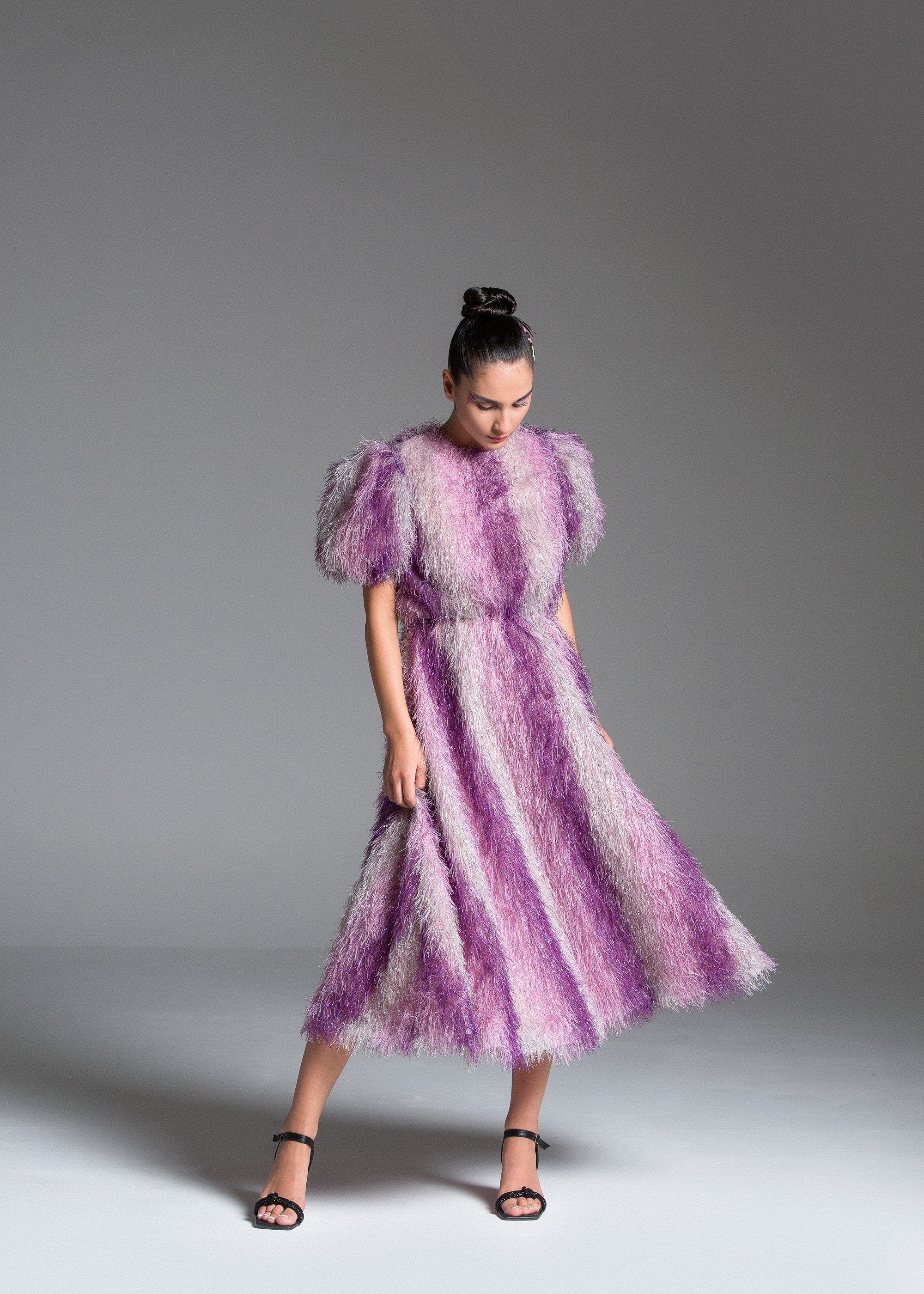 Feather Dress with metallic fabric, short puffed sleeves.