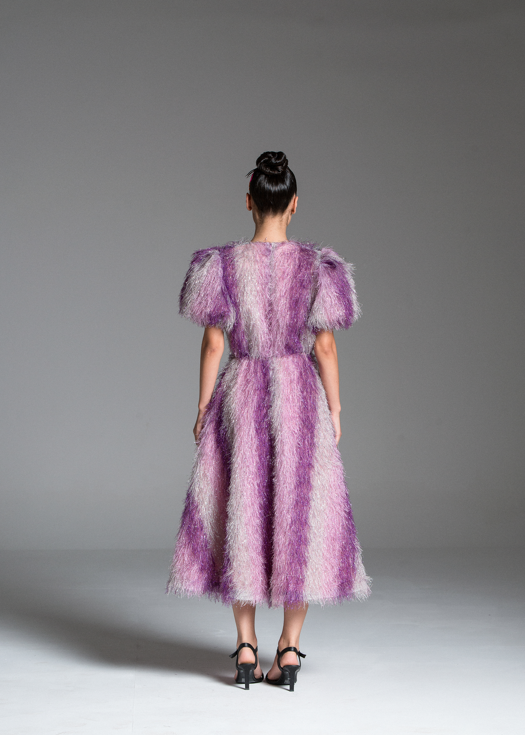 Feather Dress with metallic fabric, short puffed sleeves.