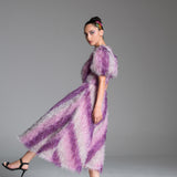 Feather Dress with metallic fabric, short puffed sleeves.