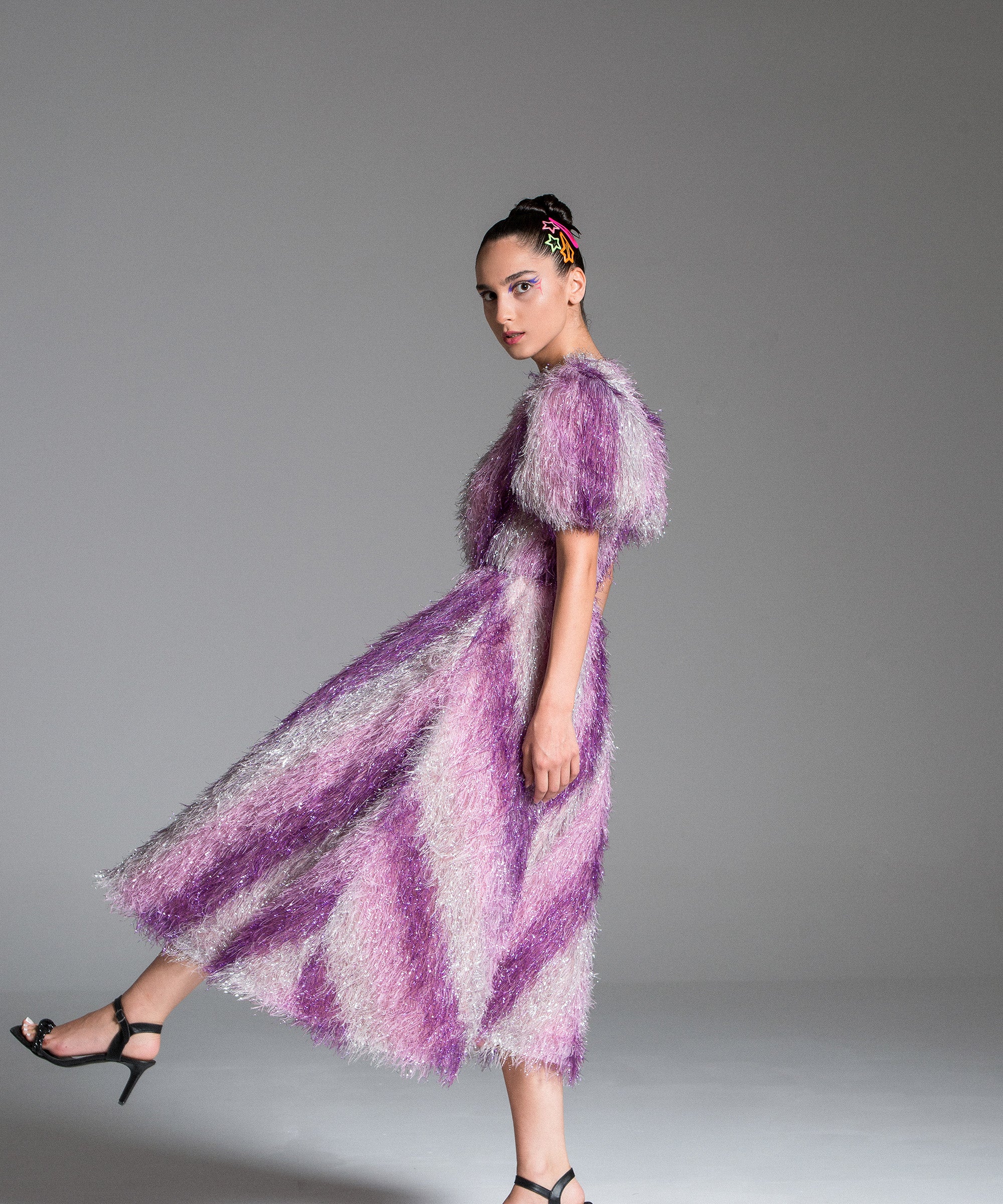 Feather Dress with metallic fabric, short puffed sleeves.