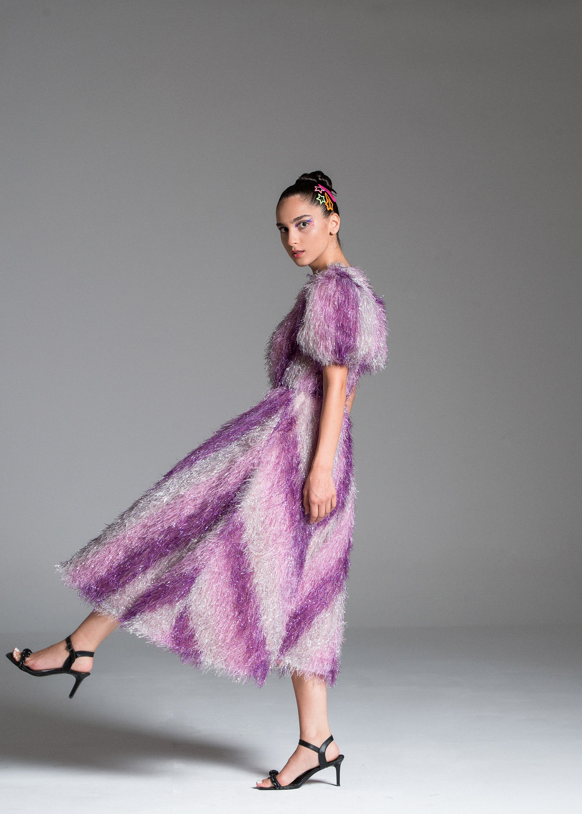 Feather Dress with metallic fabric, short puffed sleeves.