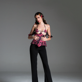 Bra with dark pink floral patterns on a black base and monstera-shaped cutouts.