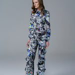 Bold abstract print top with front bow detail and structured fit. A modern, artistic statement piece. 